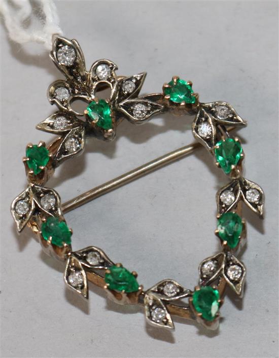 A late 19th/early 20th century yellow metal, emerald and diamond set openwork heart shaped pendant brooch, 42mm.